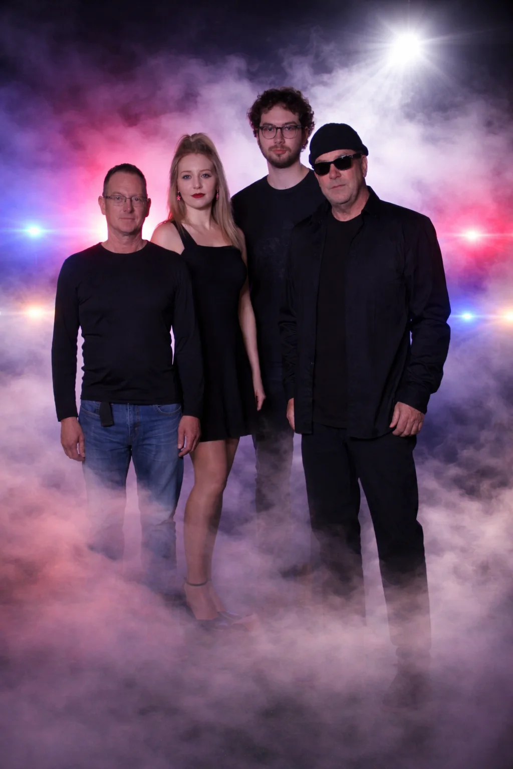 The Petty Thieves band in stage haze and backlight